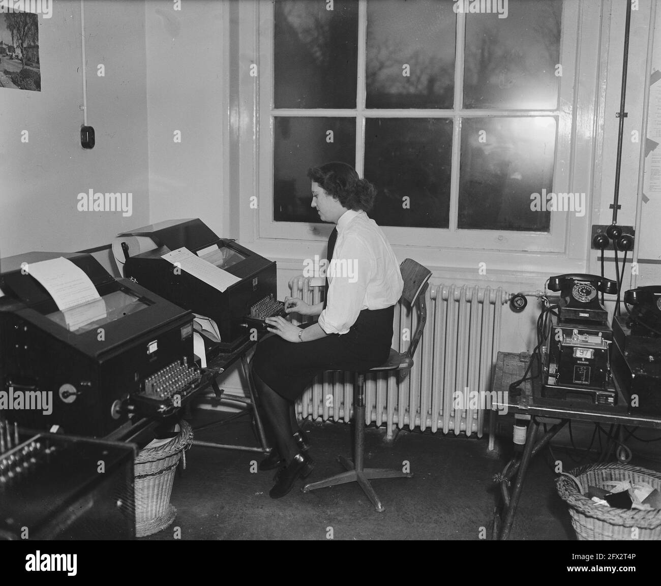 Marva telex operator in navy office Lange Voorhout 9 in The Hague, 2 February 1948, navy, telexes, The Netherlands, 20th century press agency photo, news to remember, documentary, historic photography 1945-1990, visual stories, human history of the Twentieth Century, capturing moments in time Stock Photo