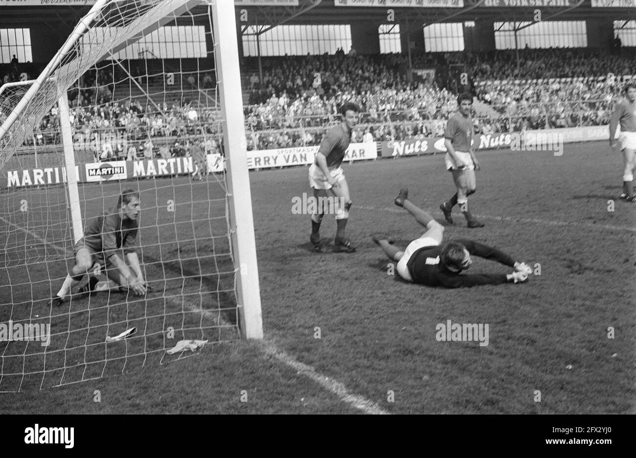 Ajax against MVV 2-1 goalkeeper Korver leaves the field injured. Substitute goalkeeper Leon Rodenburg., April 27, 1969, goalkeepers, sports, soccer, The Netherlands, 20th century press agency photo, news to remember, documentary, historic photography 1945-1990, visual stories, human history of the Twentieth Century, capturing moments in time Stock Photo