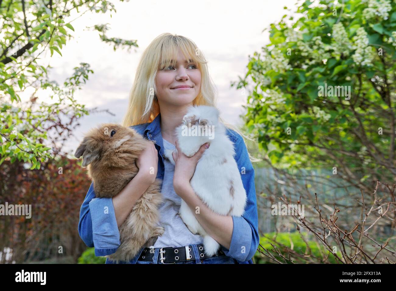 Woman with rabbits hi-res stock photography and images - Alamy