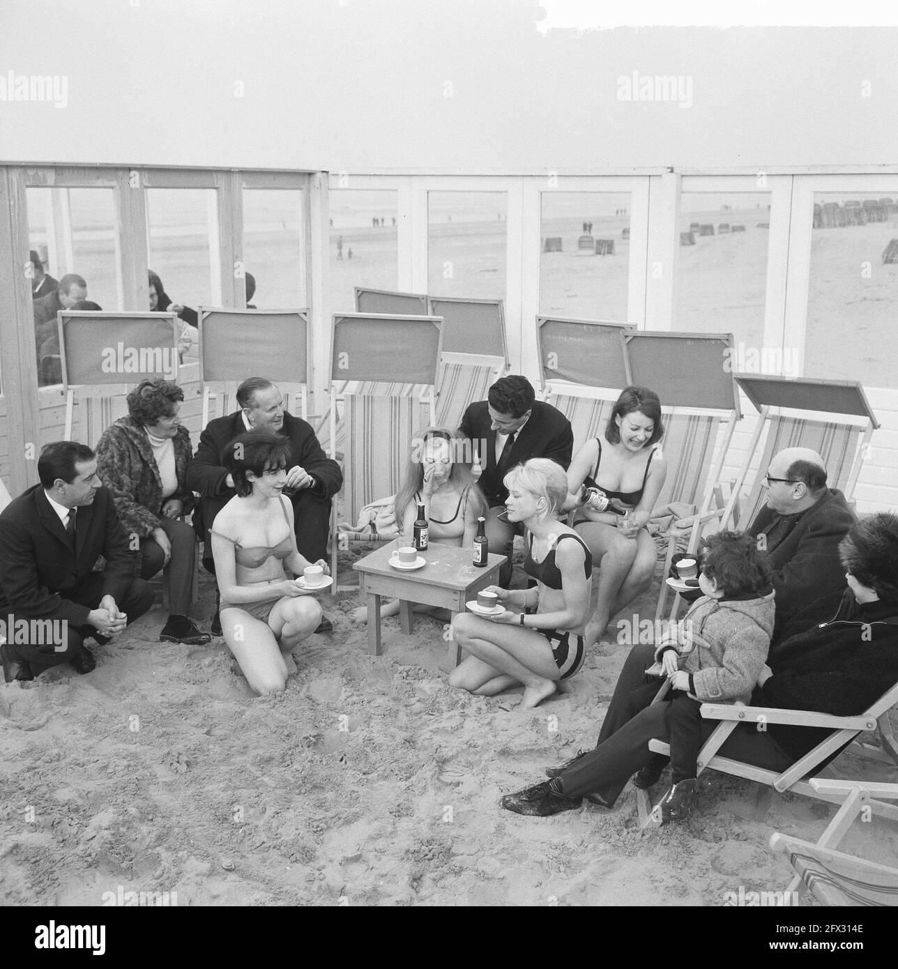 Girls in bikini in the sea at Zandvoort, the girls on a terrace, March