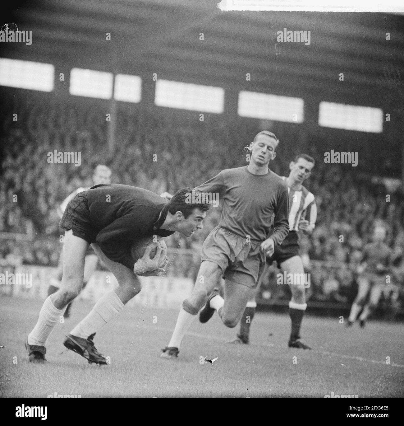 Ajax against PSV 2-0, Nuninga in duel with Strich, 5 September 1965, duels, sports, soccer, The Netherlands, 20th century press agency photo, news to remember, documentary, historic photography 1945-1990, visual stories, human history of the Twentieth Century, capturing moments in time Stock Photo