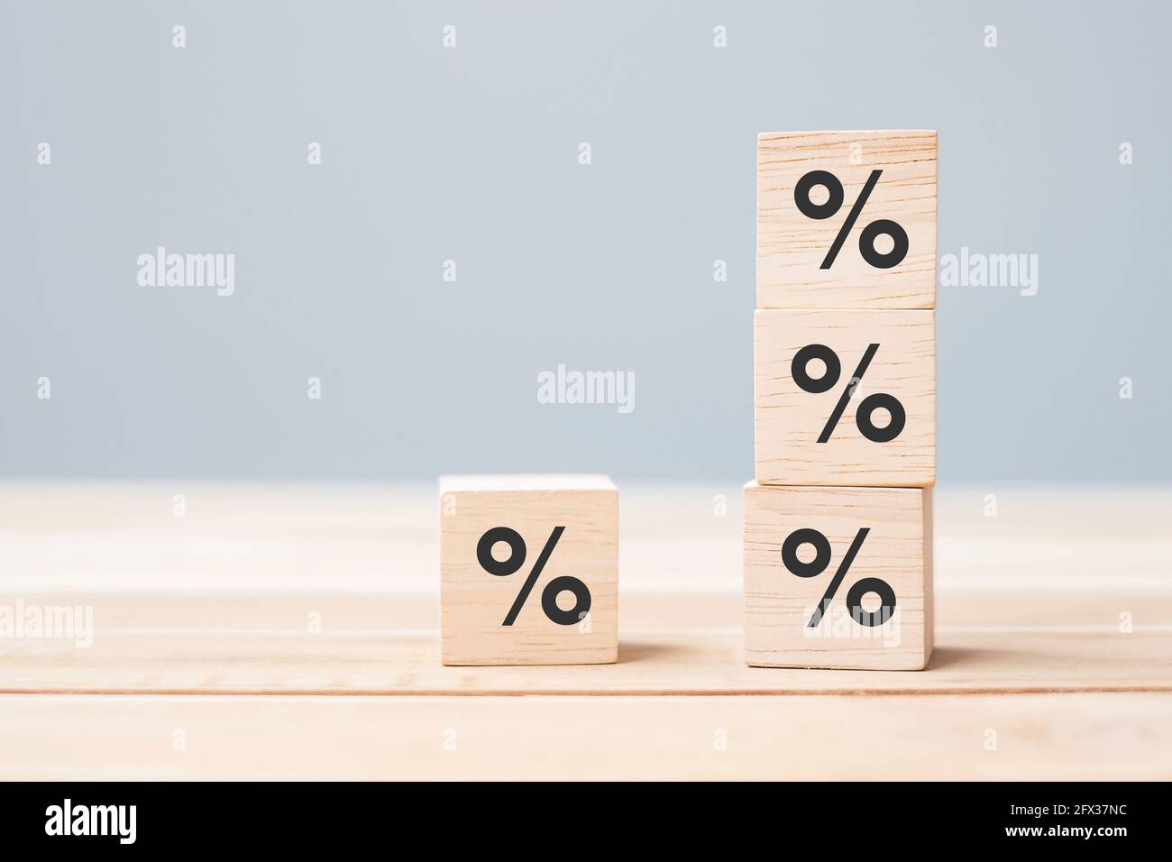 wood cube block with percentage symbol icon. Interest rate,  financial, ranking and mortgage rates concept Stock Photo