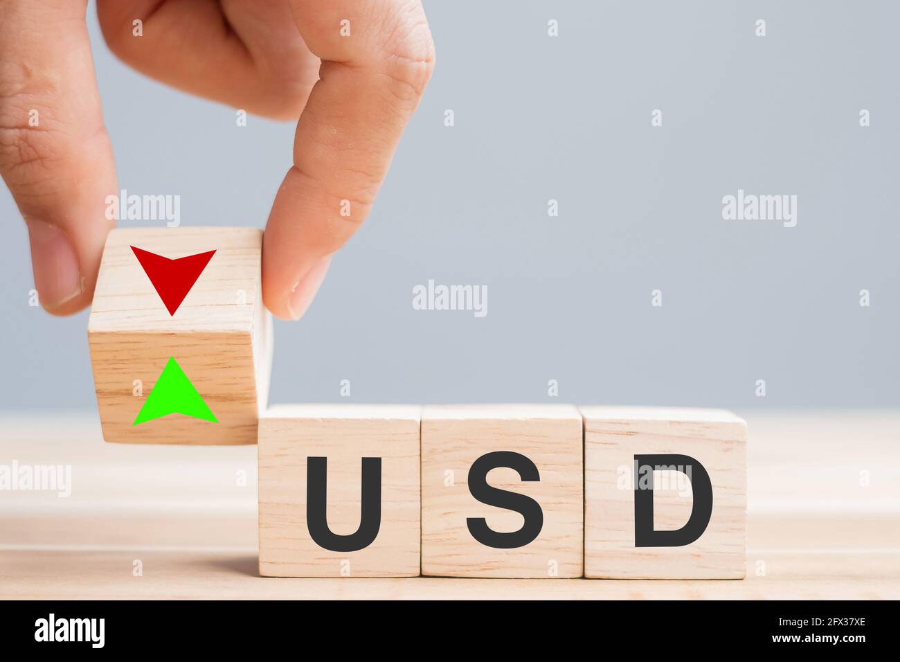 business man Hand change wood cube block with USD ( US Dollar) text to