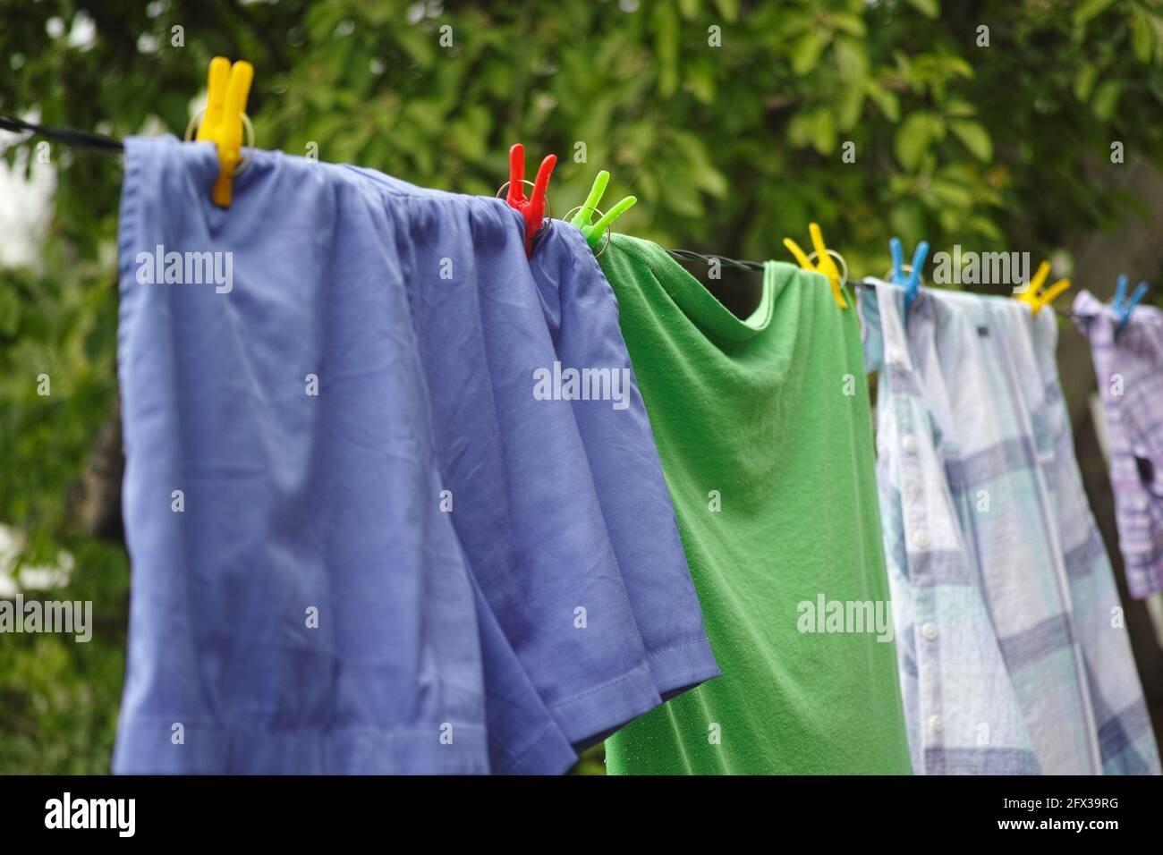 Clothes hanging on a clothes line. Close up. Stock Photo