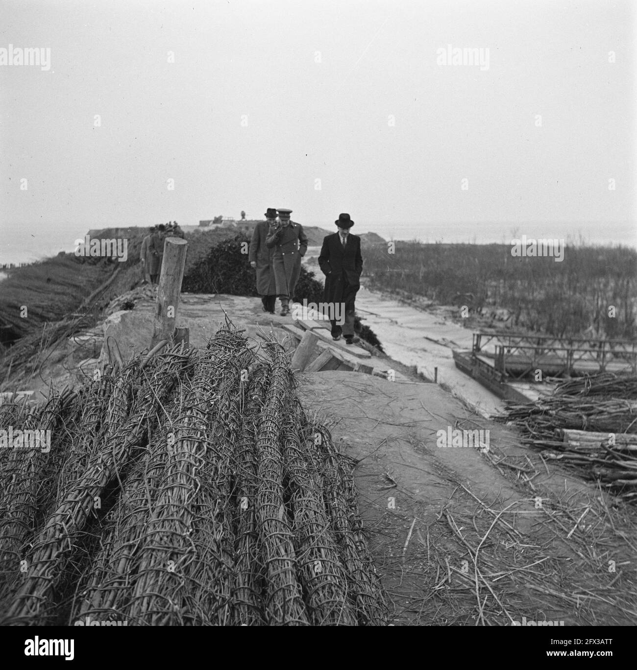 Minister Attlee during a walk along the destroyed coastal defenses, March 10, 1945, military, ministers, The Netherlands, 20th century press agency photo, news to remember, documentary, historic photography 1945-1990, visual stories, human history of the Twentieth Century, capturing moments in time Stock Photo
