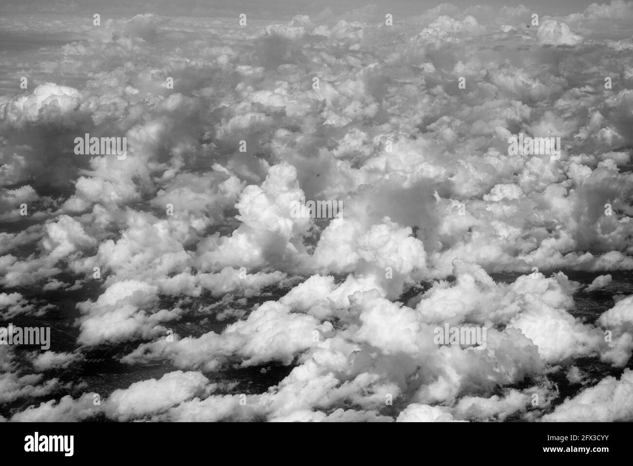 arial view of clouds and skies at 37000 ft, Thursday, May 9, 2019. Photo by Jennifer Graylock-Graylock.com 917-519-7666 Stock Photo
