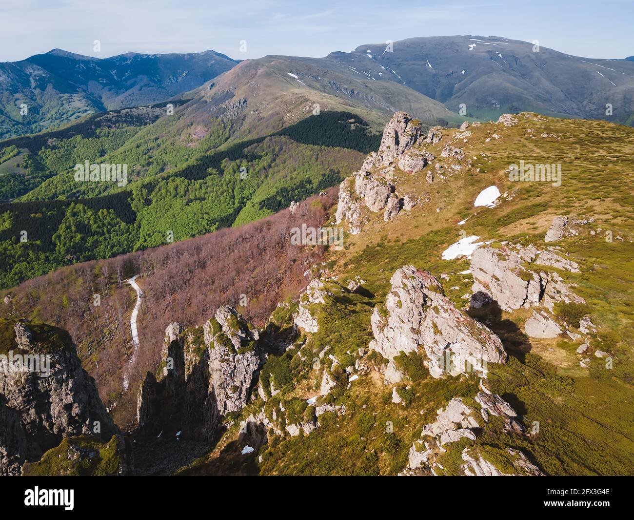 Landscape with mountains on a Sunny day. Babin Zub rock formation in Stara Planina, Balkan mountain, Nature outdoors travel destination, Serbia.Aerial Stock Photo