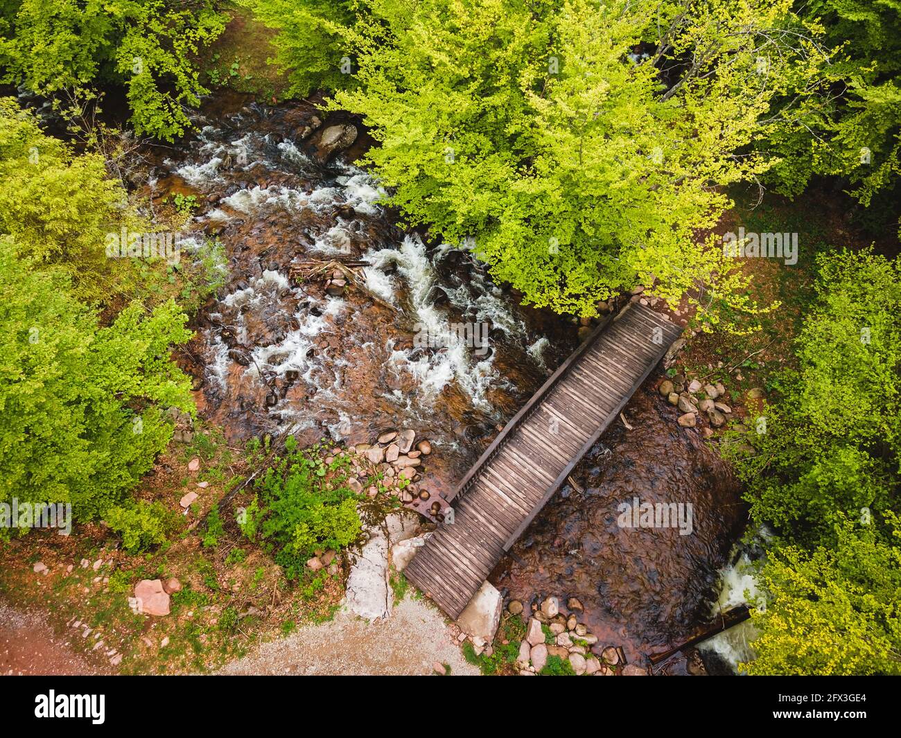 Bridge in the forest. Nature outdoors travel destination, Stara Planina (Balkan mountain), Serbia. Aerial, drone view Stock Photo