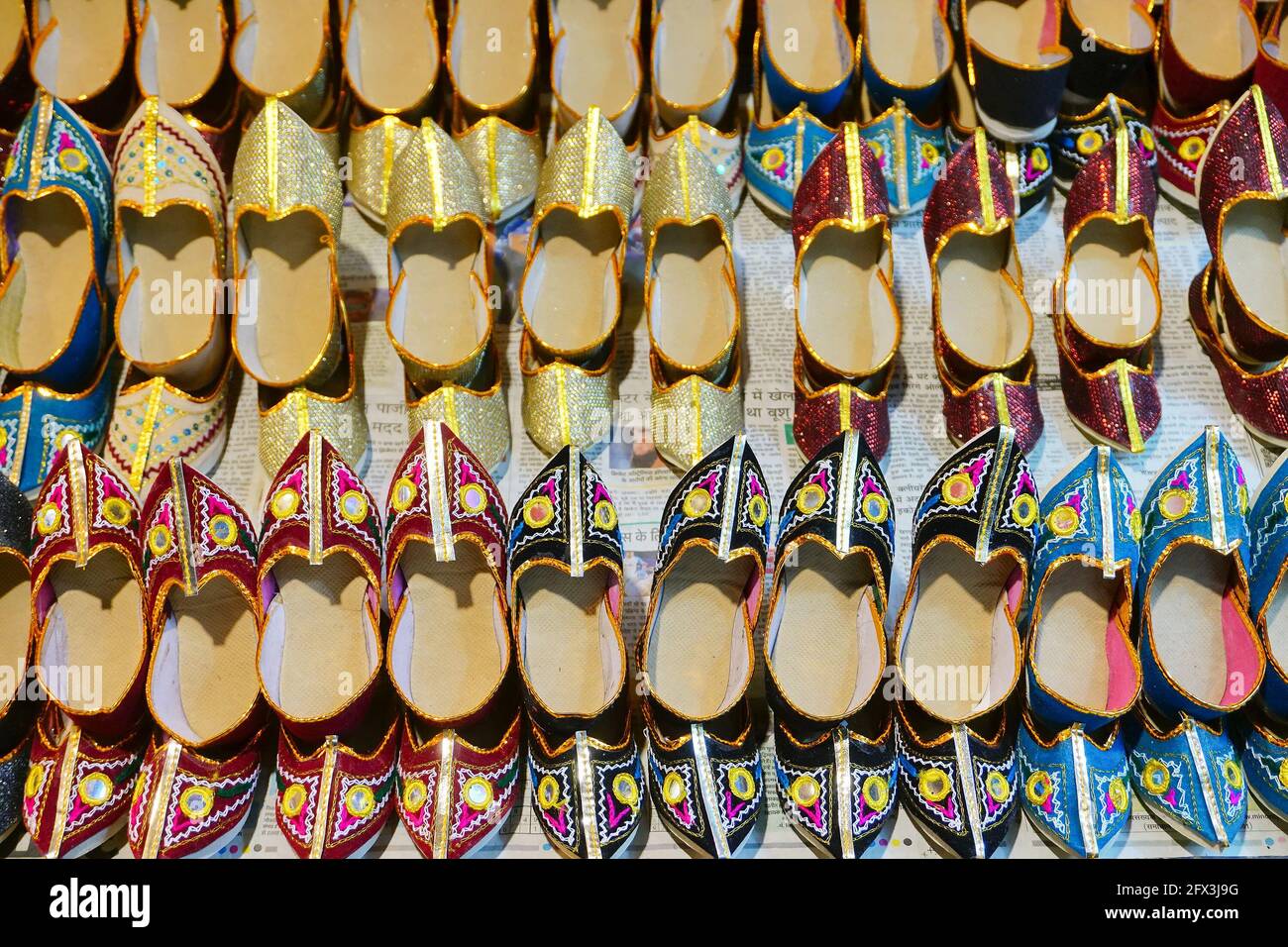 Haridwar, Garhwal, India - 3rd November 2018 : Colourful ladies shoes for sale. Night image of Motibazar, a famous market place for tourists visiting Stock Photo