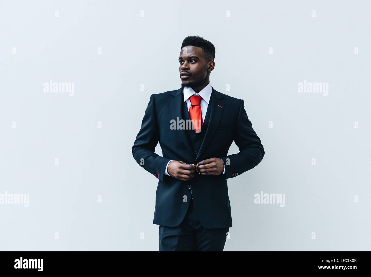 Business man in suit with white background Stock Photo - Alamy