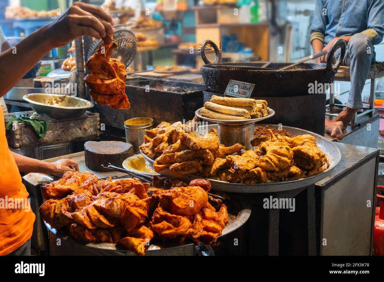 Spicy roasted tandoori chicken , chicken kabab, prepared for sale at evening as street food in