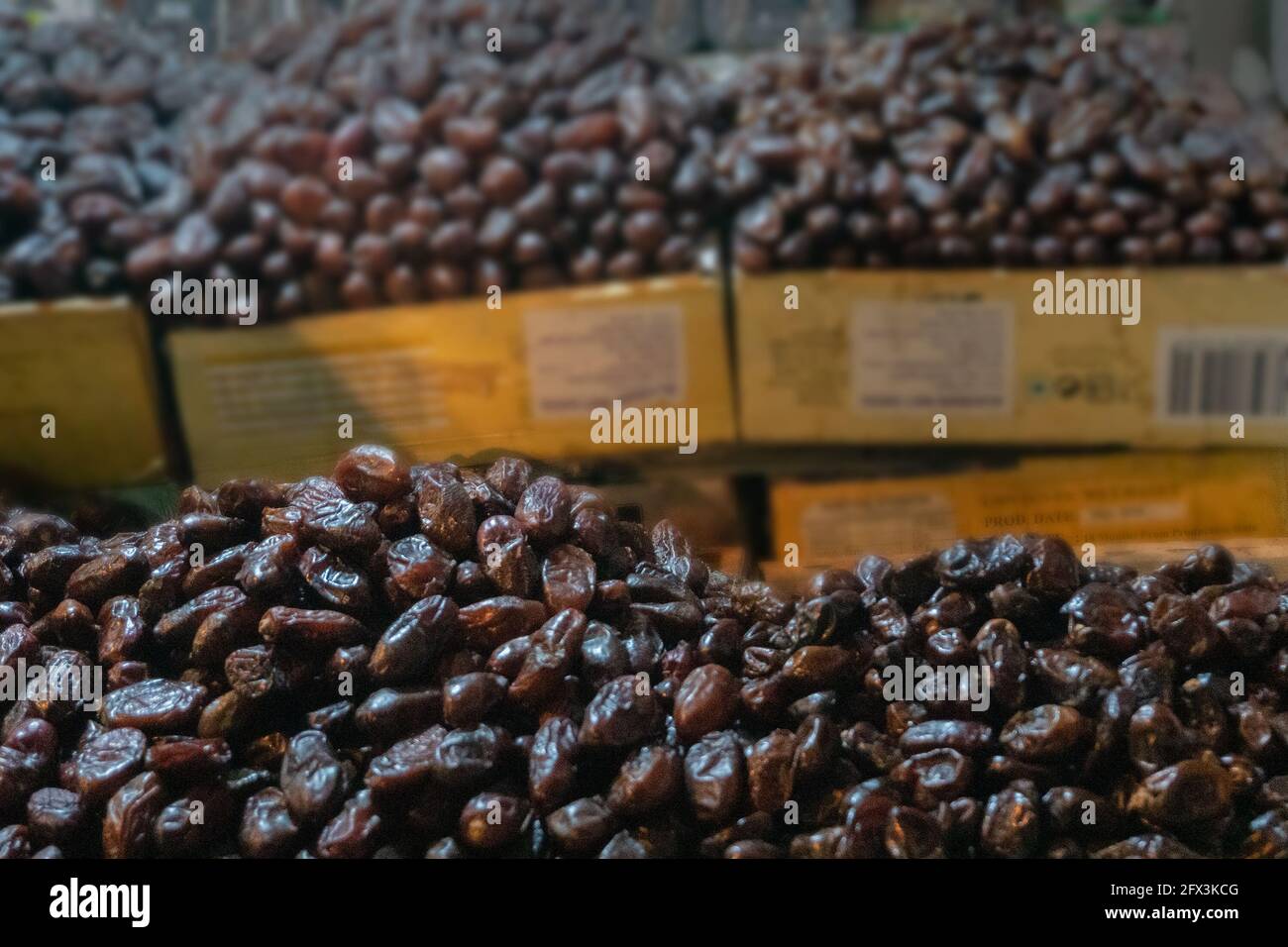 Phoenix dactylifera, commonly known as date or date palm, is a common and famous fruit item - being sold in old delhi market in the evening. Stock Photo