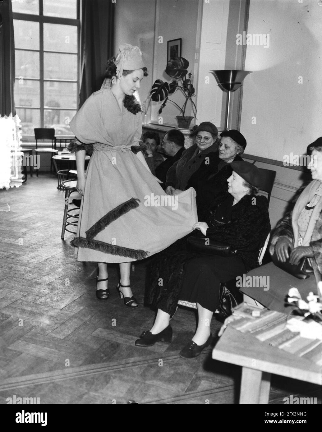Fashion show by Female student. Access 2 mops Toilette Showpiece mop,  yellow rib velvet with wool fringe, March 12, 1953, fashion shows, toilets,  The Netherlands, 20th century press agency photo, news to