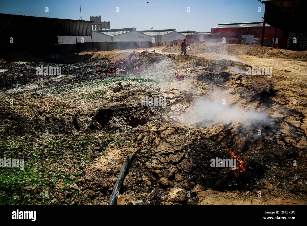 Gaza, Palestine. 25th May, 2021. A Palestinian worker salvages items