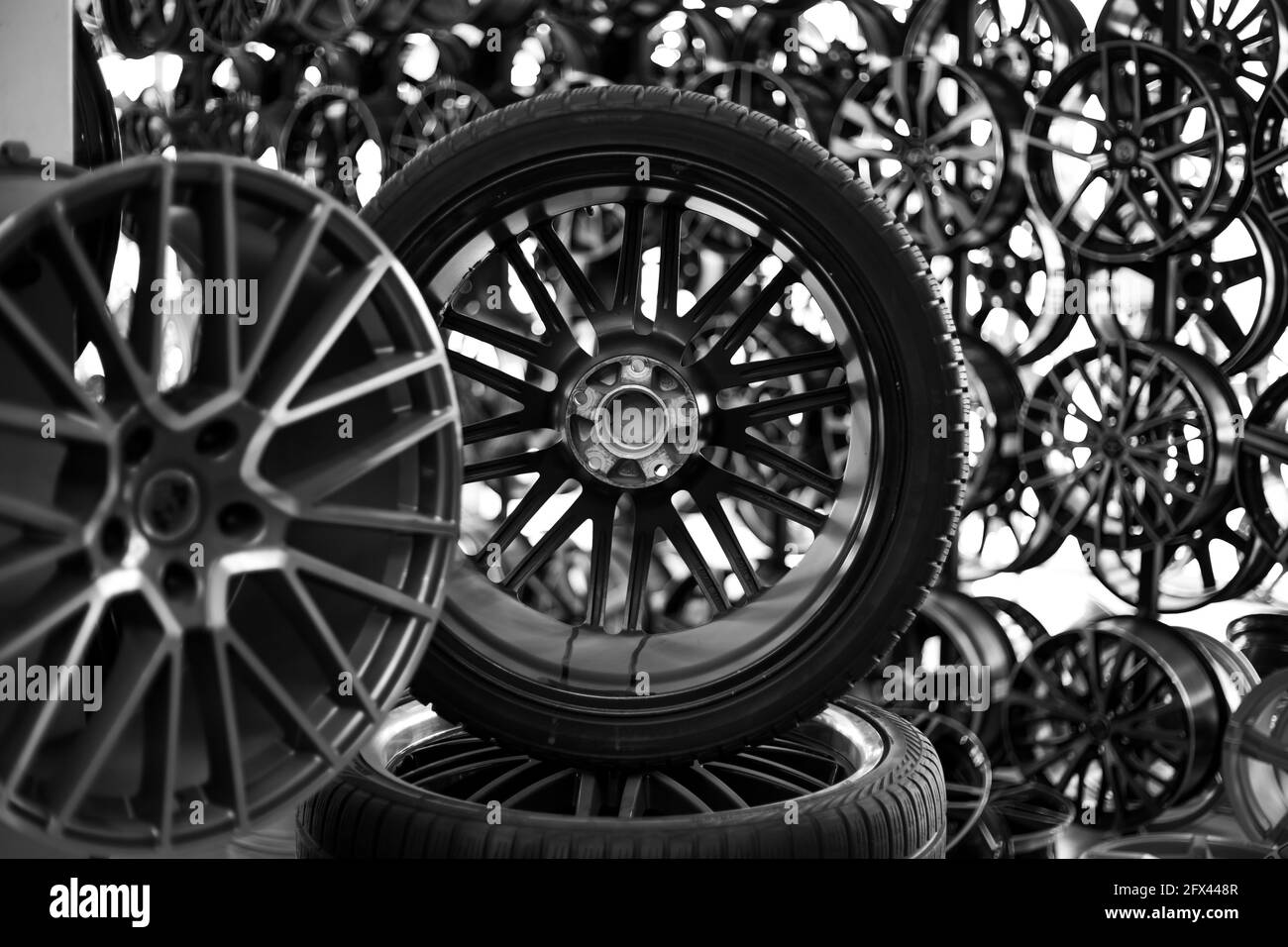 Black alloy wheels and wheels for cars. Purchase and replacement of tires and car disks. Stock Photo