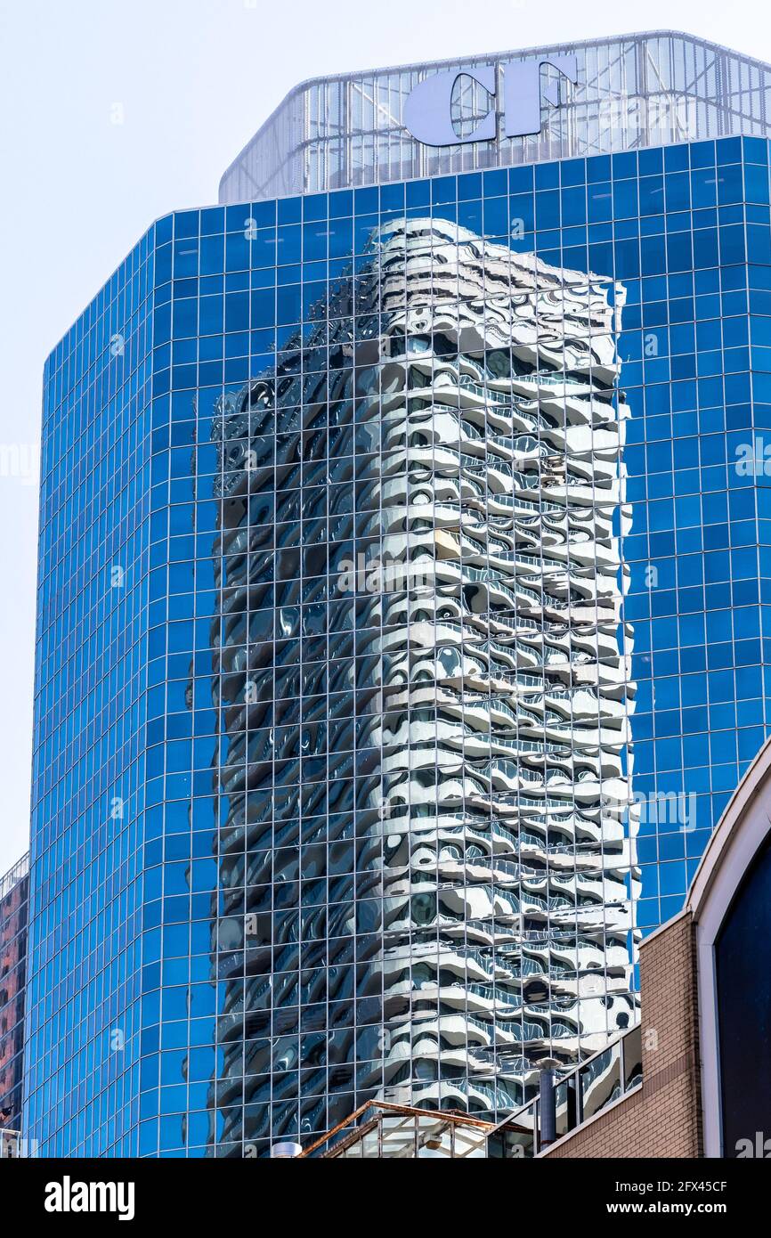 Abstract architecture of skyscrapers in Yonge Street in the Toronto downtown, Canada. The Massey Tower is reflected in the Cadillac Fairview Building Stock Photo