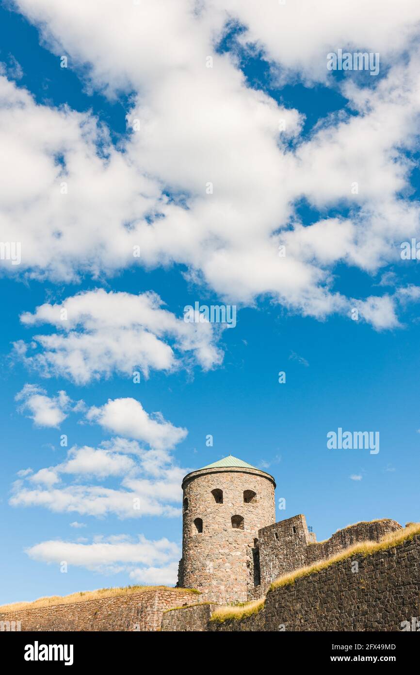 Old fortress tower against blue sky Stock Photo