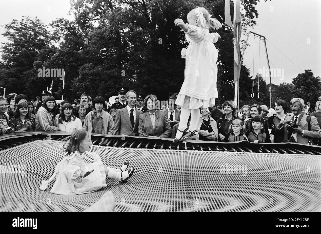 Defile Soestdijk, last; during walk across the center grounds; under the  watchful eye of Princess Irene and Carlos, their daughters jump on the  trampoline, May 31, 1980, Defiles, The Netherlands, 20th century