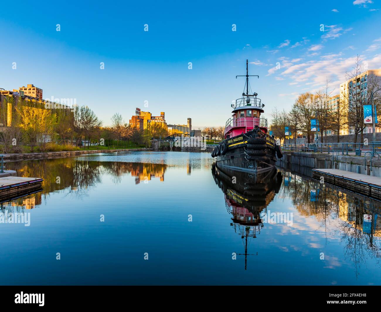 Beautiful view of the Daniel McAllister tugboat located just west of the Café des Eclusiers, in Old Montreal, Canada Stock Photo