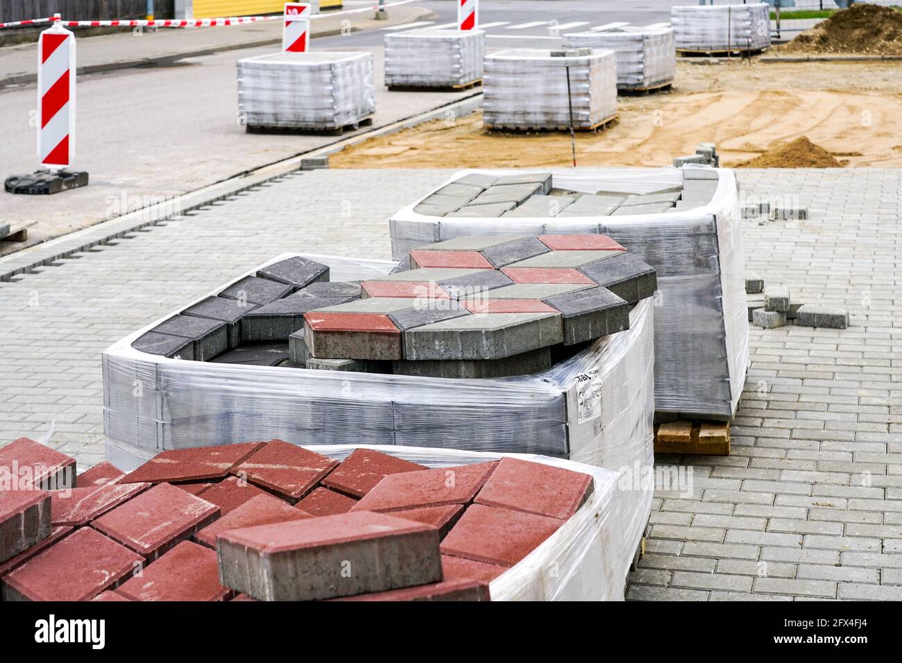 paving with paving slabs of different colors, view of the construction
