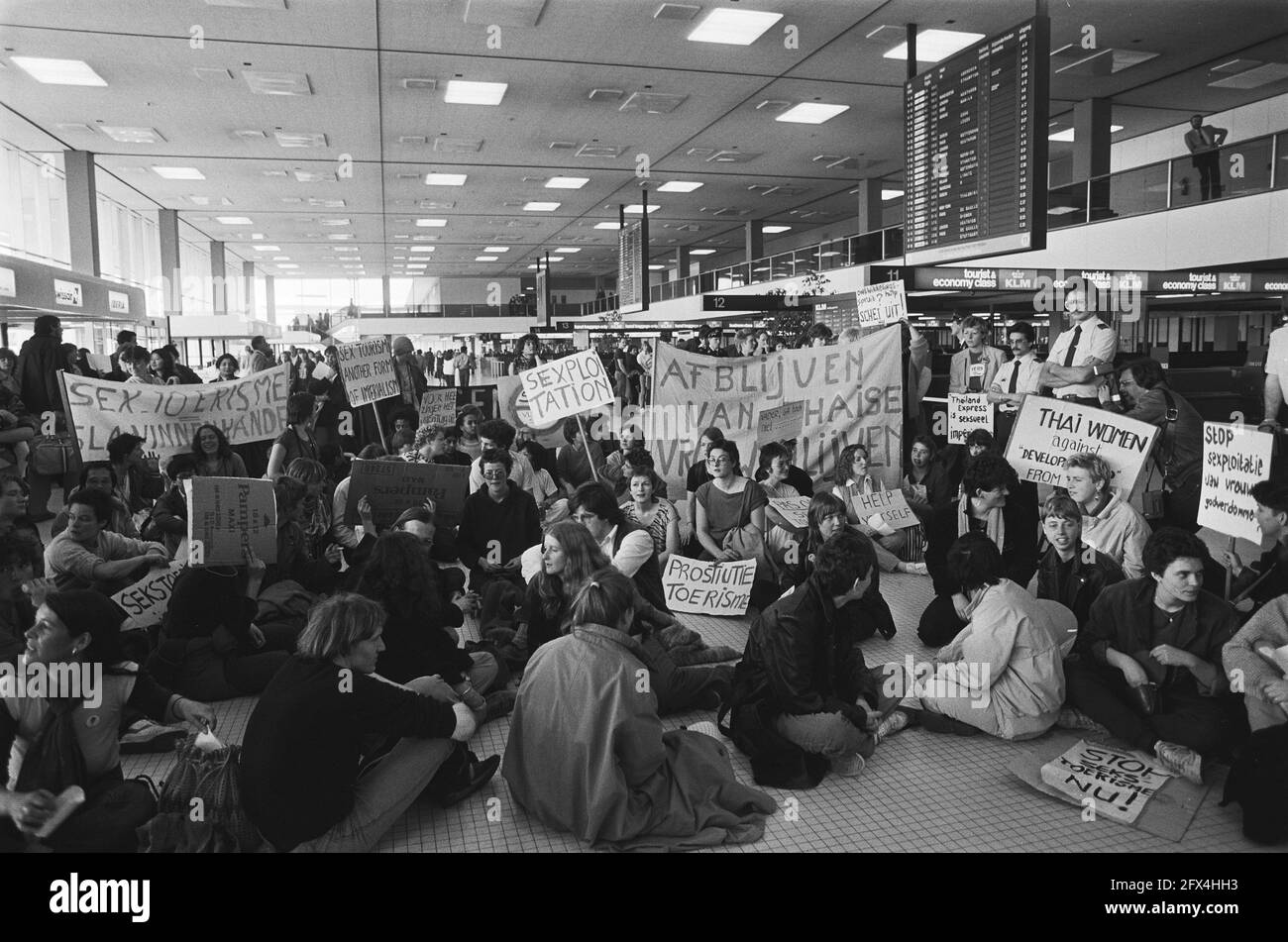 Demonstration at Schiphol against so-called sex trips to Bangkok organized by travel agency in Hoorn, April 5, 1982, Demonstration, The Netherlands, 20th century press agency photo, news to remember, documentary, historic photography 1945-1990, visual stories, human history of the Twentieth Century, capturing moments in time Stock Photo