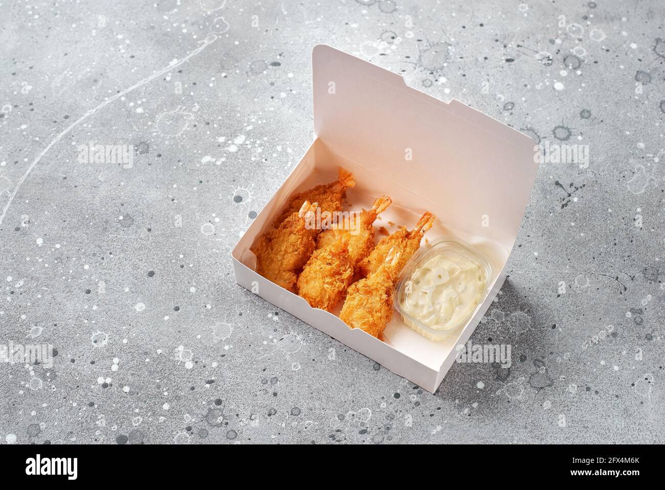 food delivery, takeaway food with tempura shrimps, paper containers with shrimps and sauce. menu