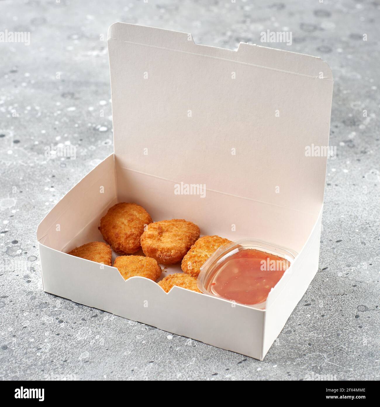 food delivery, takeaway food in paper containers with hot chicken