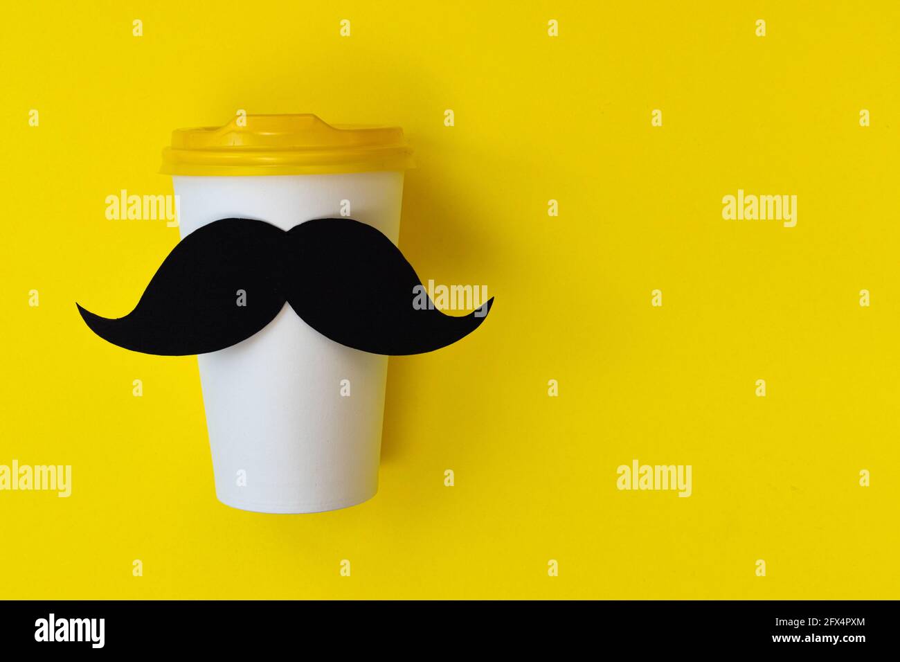 happy father day concept, black mustache on paper cup for coffee on yellow background with empty space for text Stock Photo