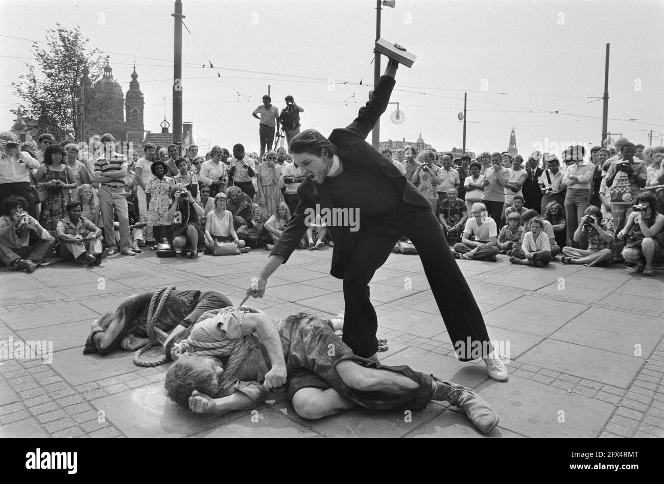 Evangelists perform a play to proclaim their message in front of Central Station, July 16, 1983, conferences, evangelism, street theater, The Netherlands, 20th century press agency photo, news to remember, documentary, historic photography 1945-1990, visual stories, human history of the Twentieth Century, capturing moments in time Stock Photo