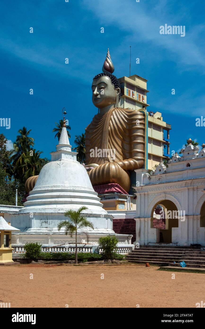 Dikwella, Wewurukannala Vihara Temple, Sri Lanka: the large buddha statue dominates the entrance of the temple Stock Photo