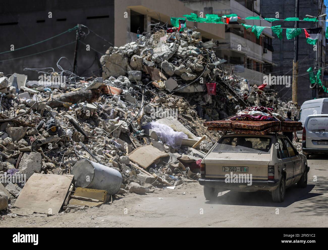 Gaza City, The Gaza Strip, Palestine. 23rd May, 2021. A car passes near