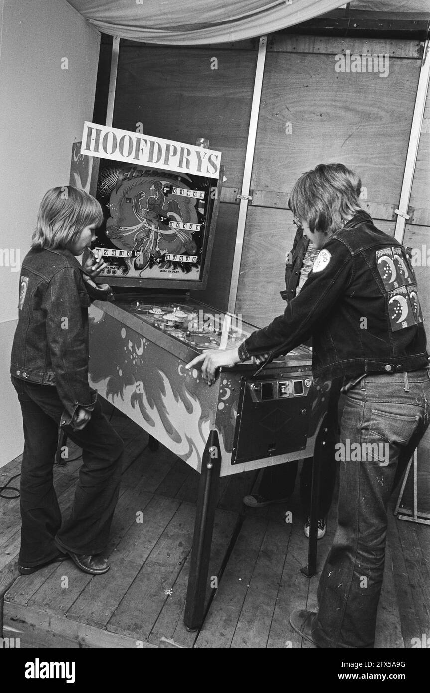 Pinball championships on Museumplein Amsterdam, boys watching pinball