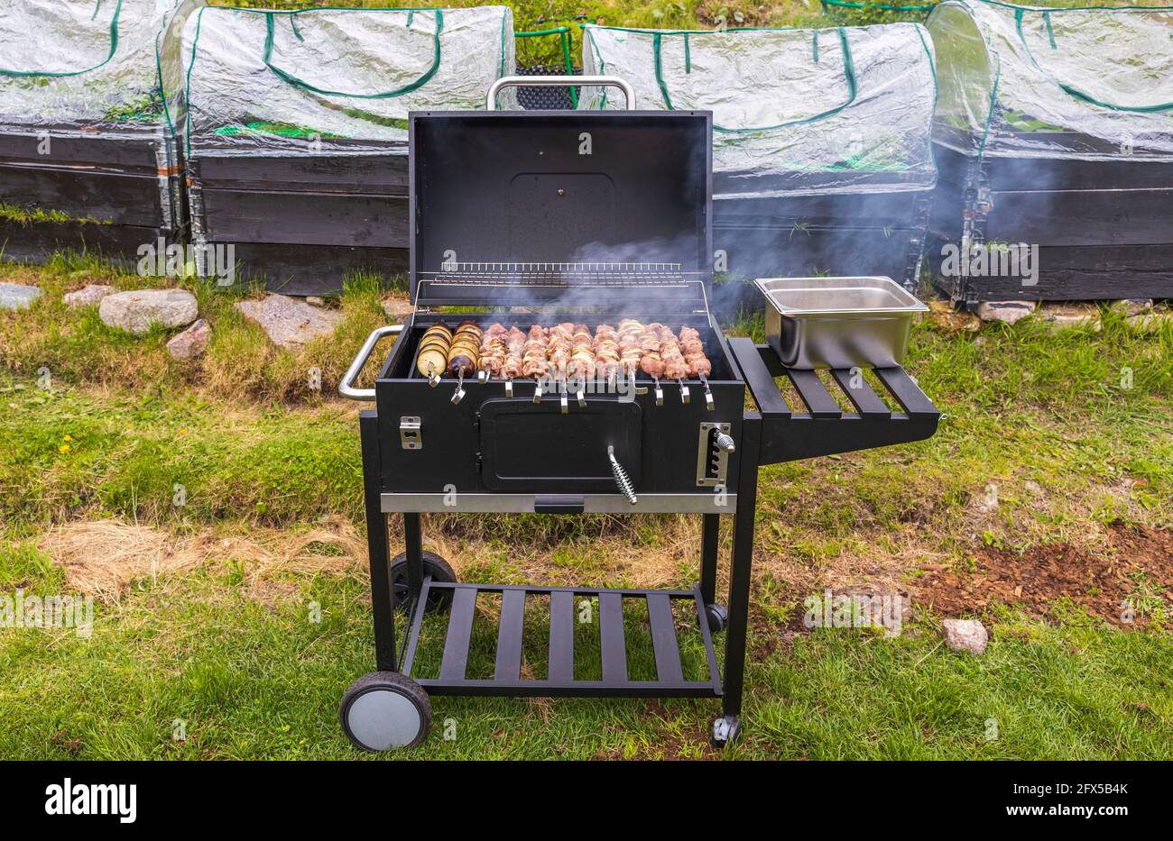 View of barbecue on grill on backyard of private house. Sweden Stock Photo  - Alamy