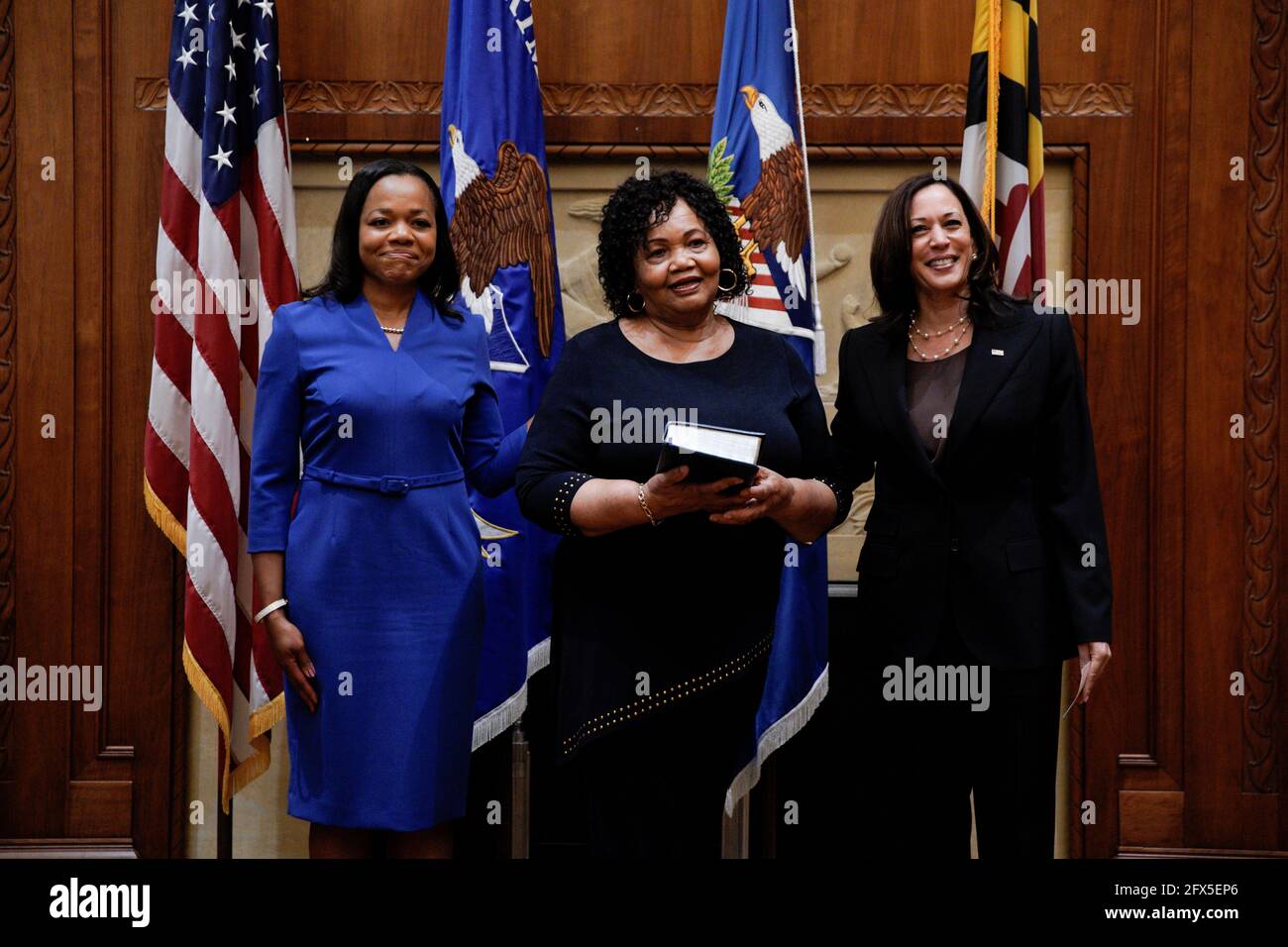 Kristen Clarke (L) stands next to her mother Pansy Clarke during her swearing in ceremony as Assistant Attorney General for the Civil Rights Division by U.S. Vice President Kamala Harris (R), at the Department of Justice in Washington, U.S., May 25, 2021. REUTERS/Yuri Gripas Stock Photo