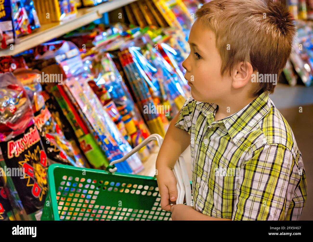 A boy shops for fireworks, July 1, 2011, in Columbus, Mississippi. Roadside fireworks stands are a popular sight in the American South. Stock Photo