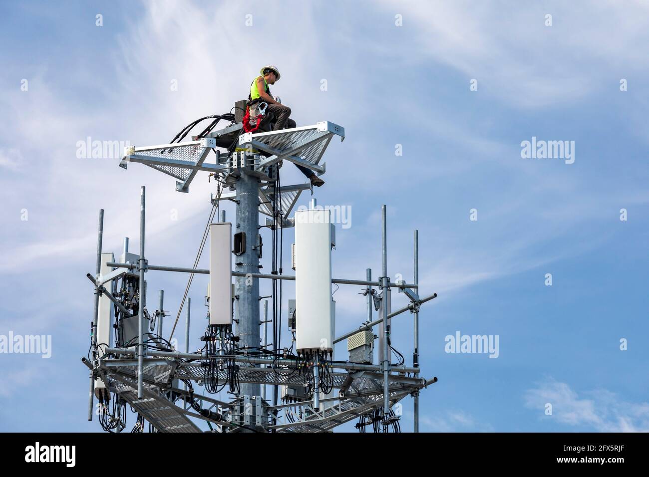 Detroit, Michigan - Workers upgrade an AT&T cell tower to the faster 5G ...