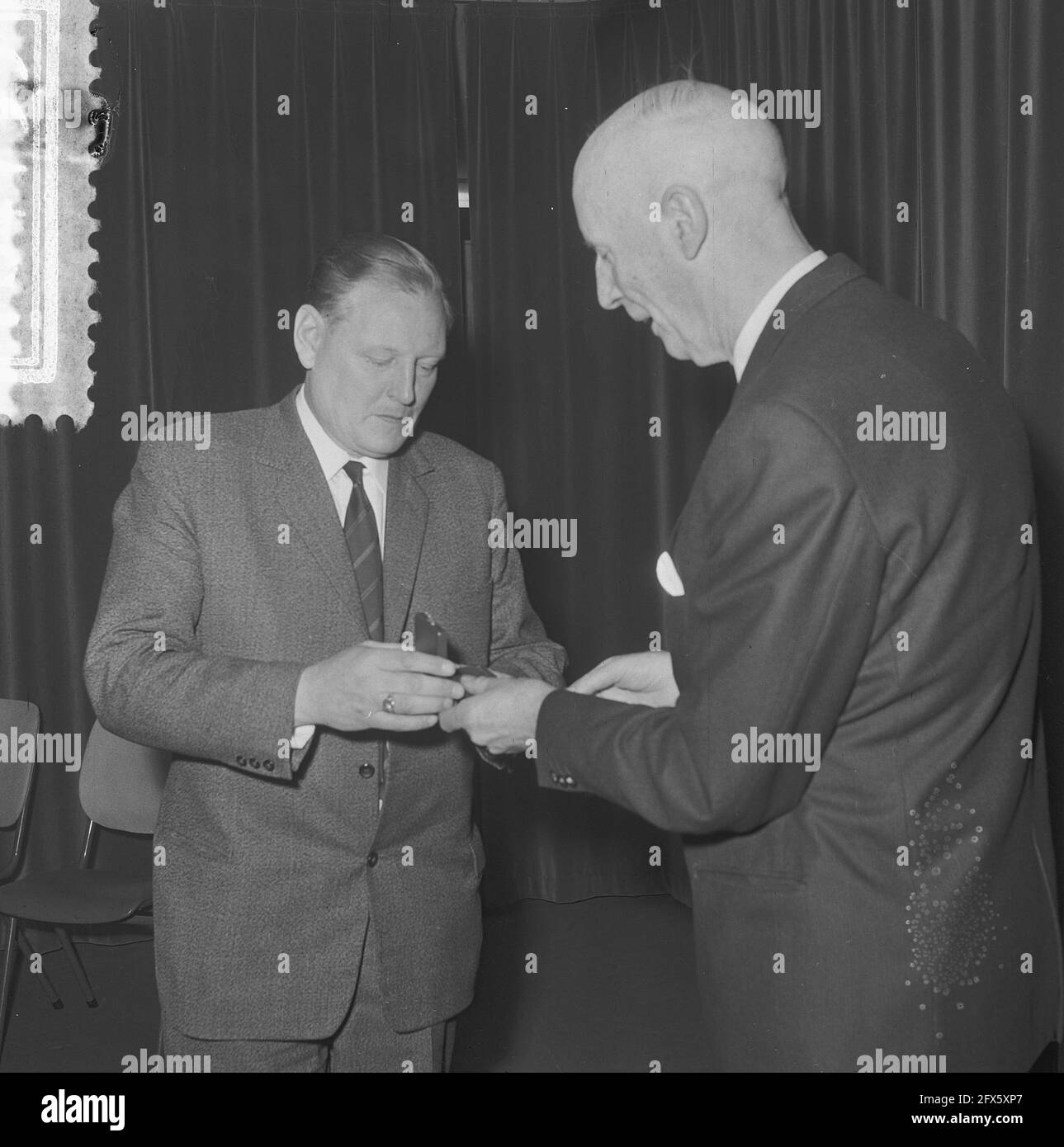 Green Cross pioneer Mr. Noteboom on receiving a medal, November 20
