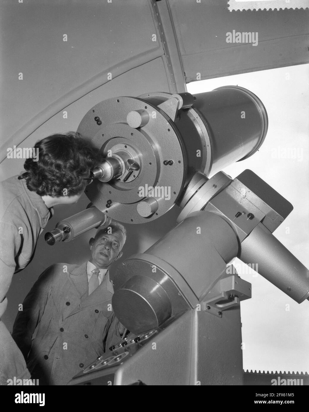 Installation of new Van Straaten telescope in the dome of the Utrecht  Observatory, interior of the dome with the Van Straaten telescope and the  observer Miss, 18 June 1959, The Netherlands, 20th