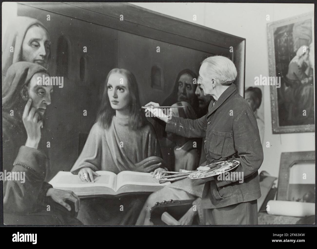 Han van Meegeren (1889-1947) paints Jesus in conversation with the scribes  in 1945 as a demonstration of his ability, October 1945, brushes,  paintings, painting, scribes, paint, forgeries, The Netherlands, 20th  century press