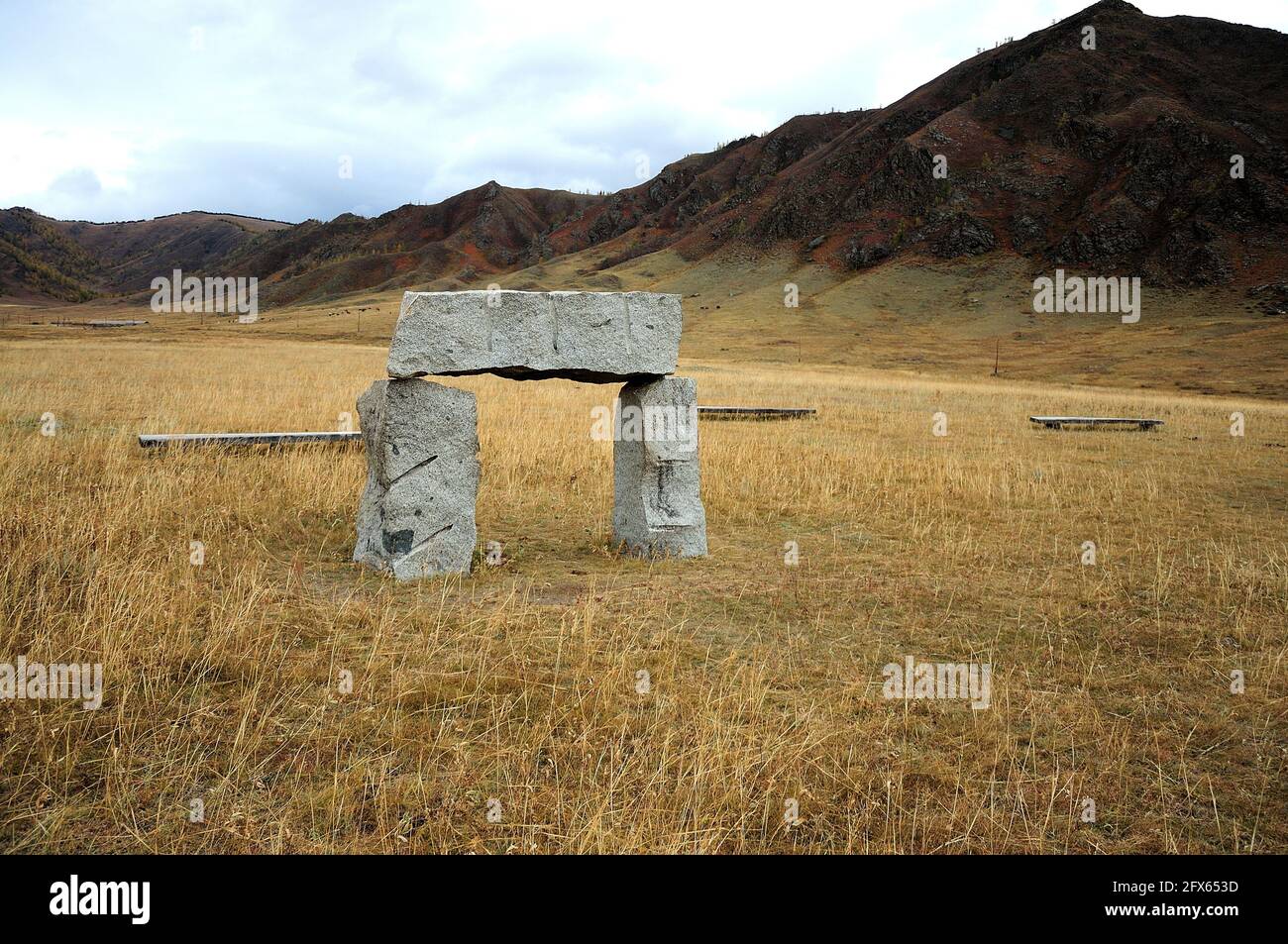 An ancient stone ritual structure in the autumn steppe. Karakol Valley ...