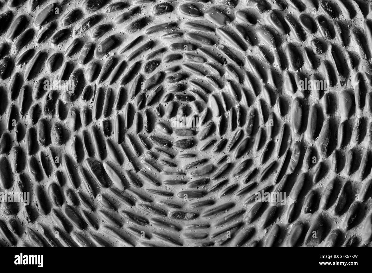 Pebbles Cemented Together in a Radial Pattern Stock Photo