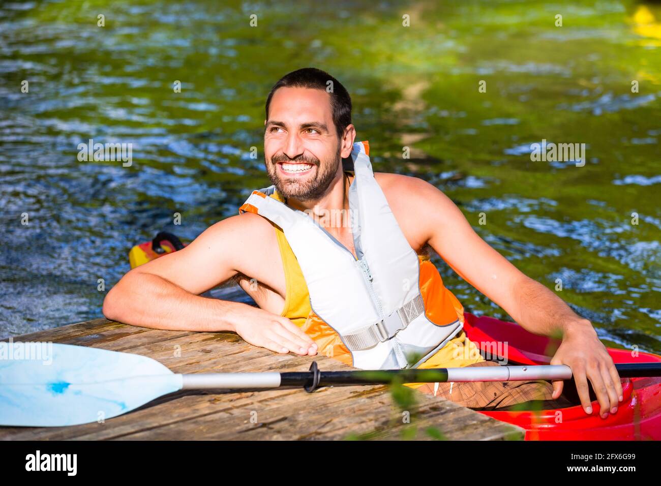 Man driving boat handsome hi-res stock photography and images - Alamy