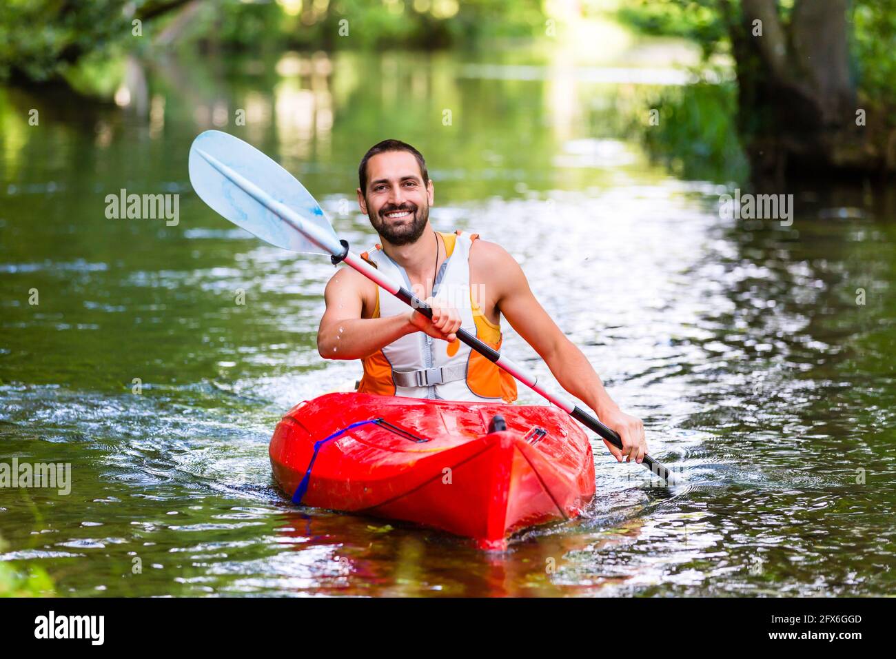 Man driving boat handsome hi-res stock photography and images - Alamy