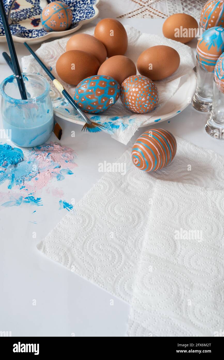 Table with handmade creative easter egg decoration Stock Photo