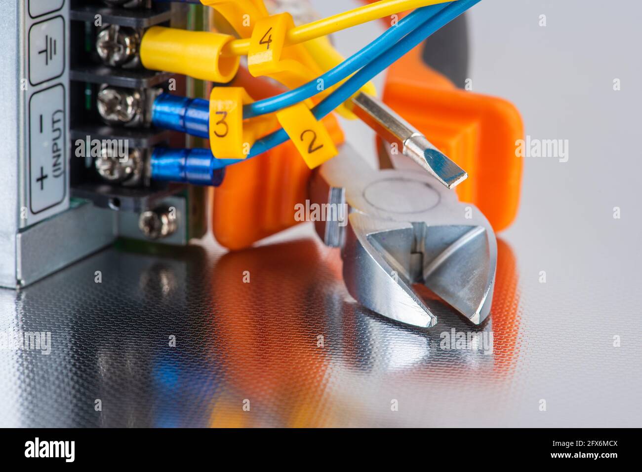 Electrical hand tool with installation cable wire close-up, service and repairing concept Stock Photo