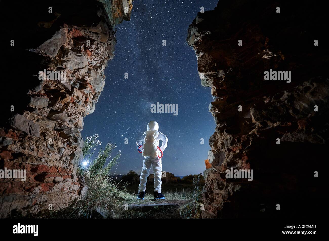 astronaut, standing spaceman isolated on black background Stock Photo -  Alamy