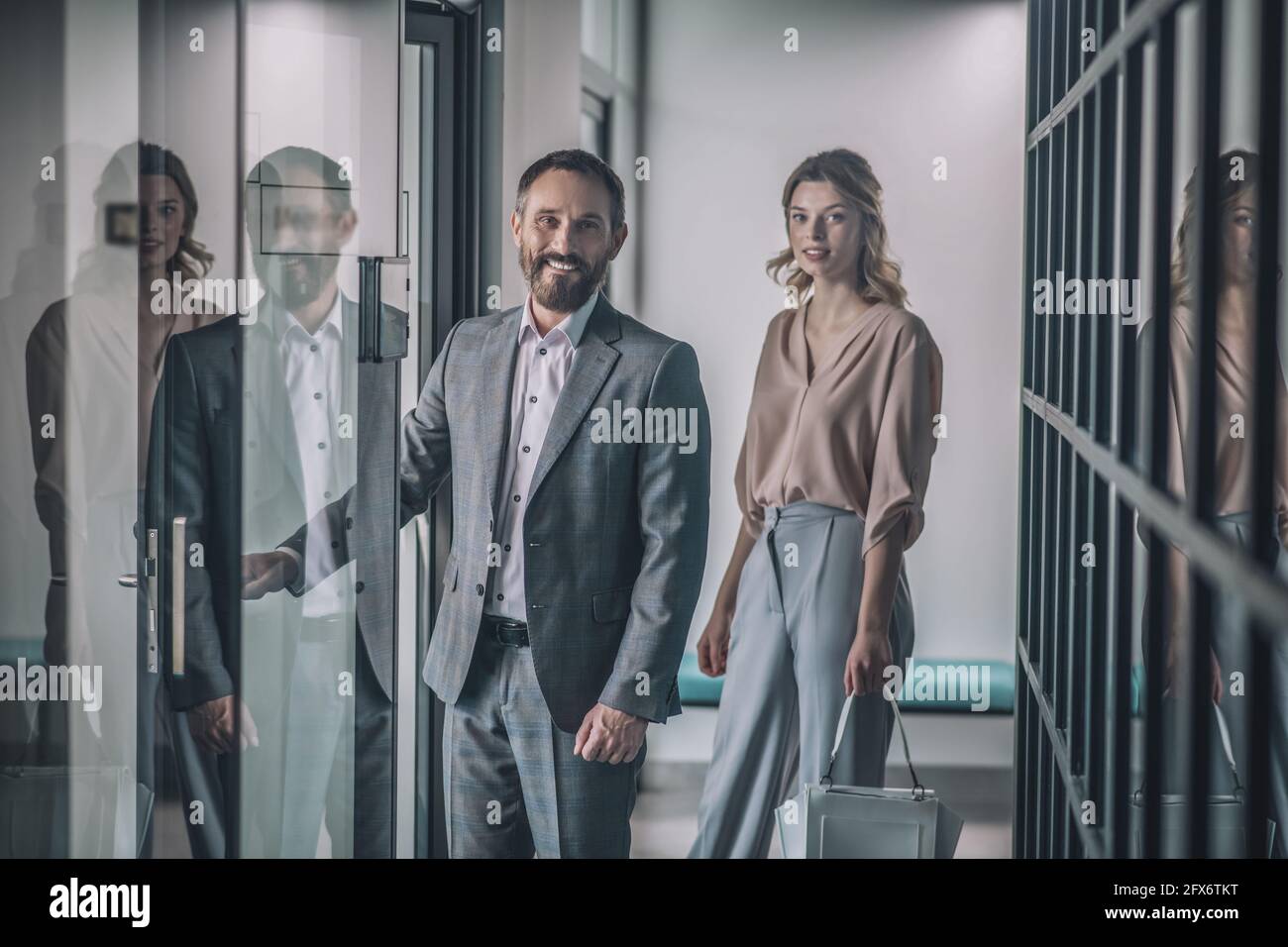 Man woman office entrance hi-res stock photography and images - Alamy