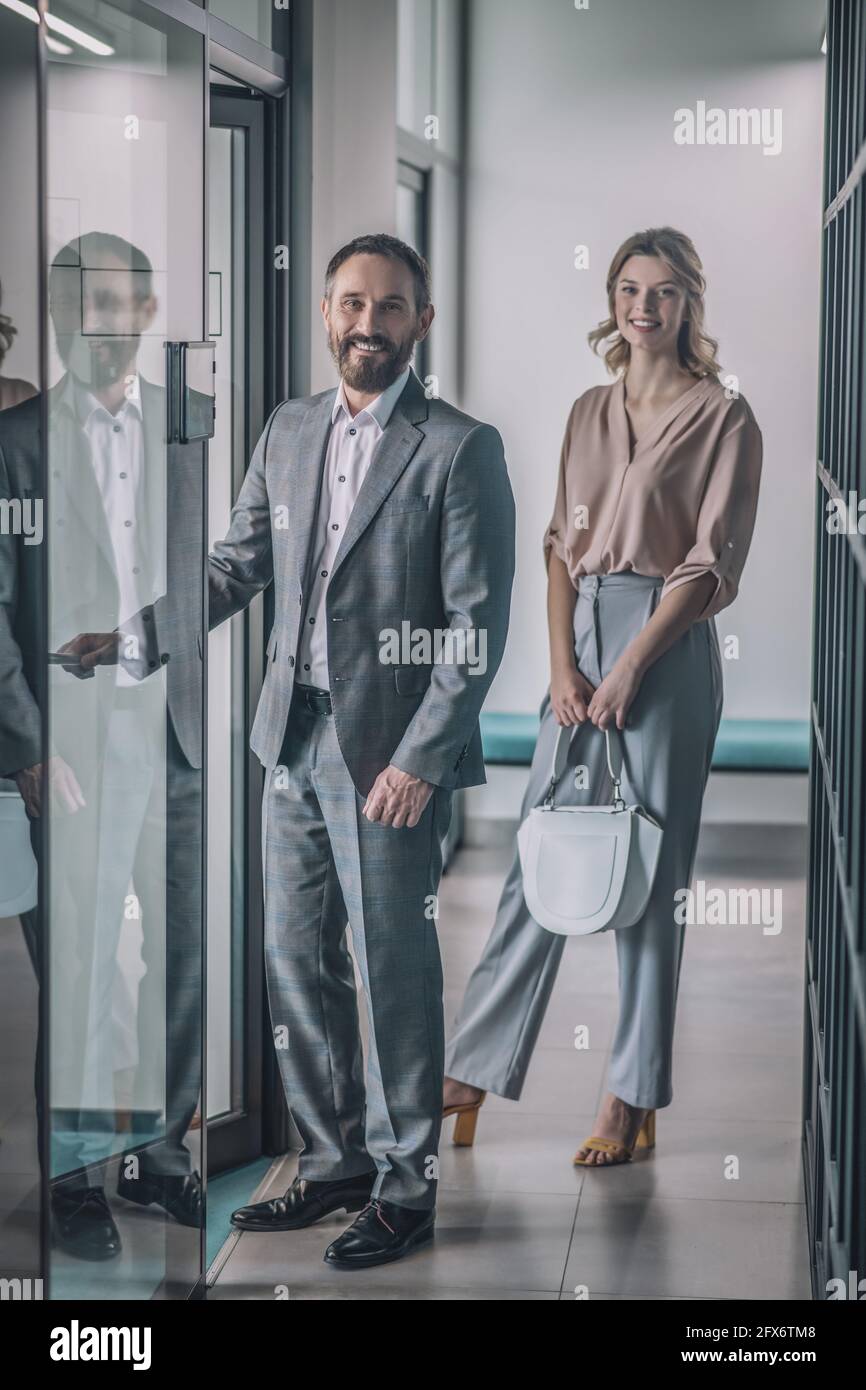 Man woman office entrance hi-res stock photography and images - Alamy