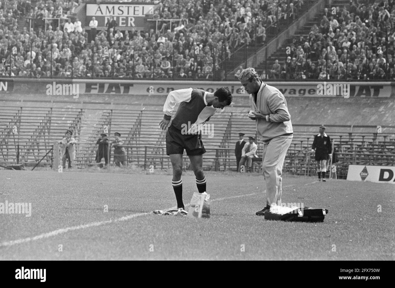 Coen Moulijn injured along the line, 28 August 1966, sport, soccer, The Netherlands, 20th century press agency photo, news to remember, documentary, historic photography 1945-1990, visual stories, human history of the Twentieth Century, capturing moments in time Stock Photo