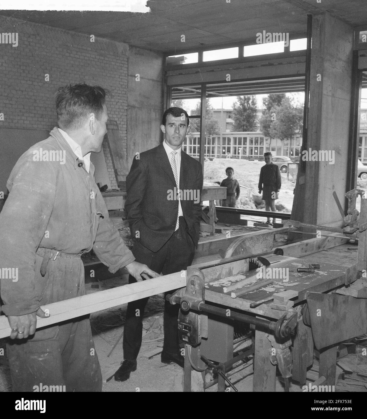 Coen Moulijn in his store under construction, June 1, 1961, construction, soccer, stores, The Netherlands, 20th century press agency photo, news to remember, documentary, historic photography 1945-1990, visual stories, human history of the Twentieth Century, capturing moments in time Stock Photo